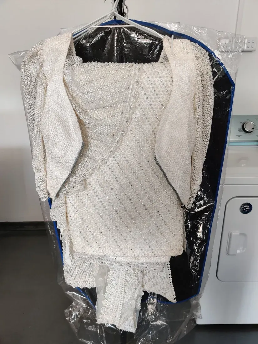 Ivory beaded bridal gown professionally cleaned in Gampaha