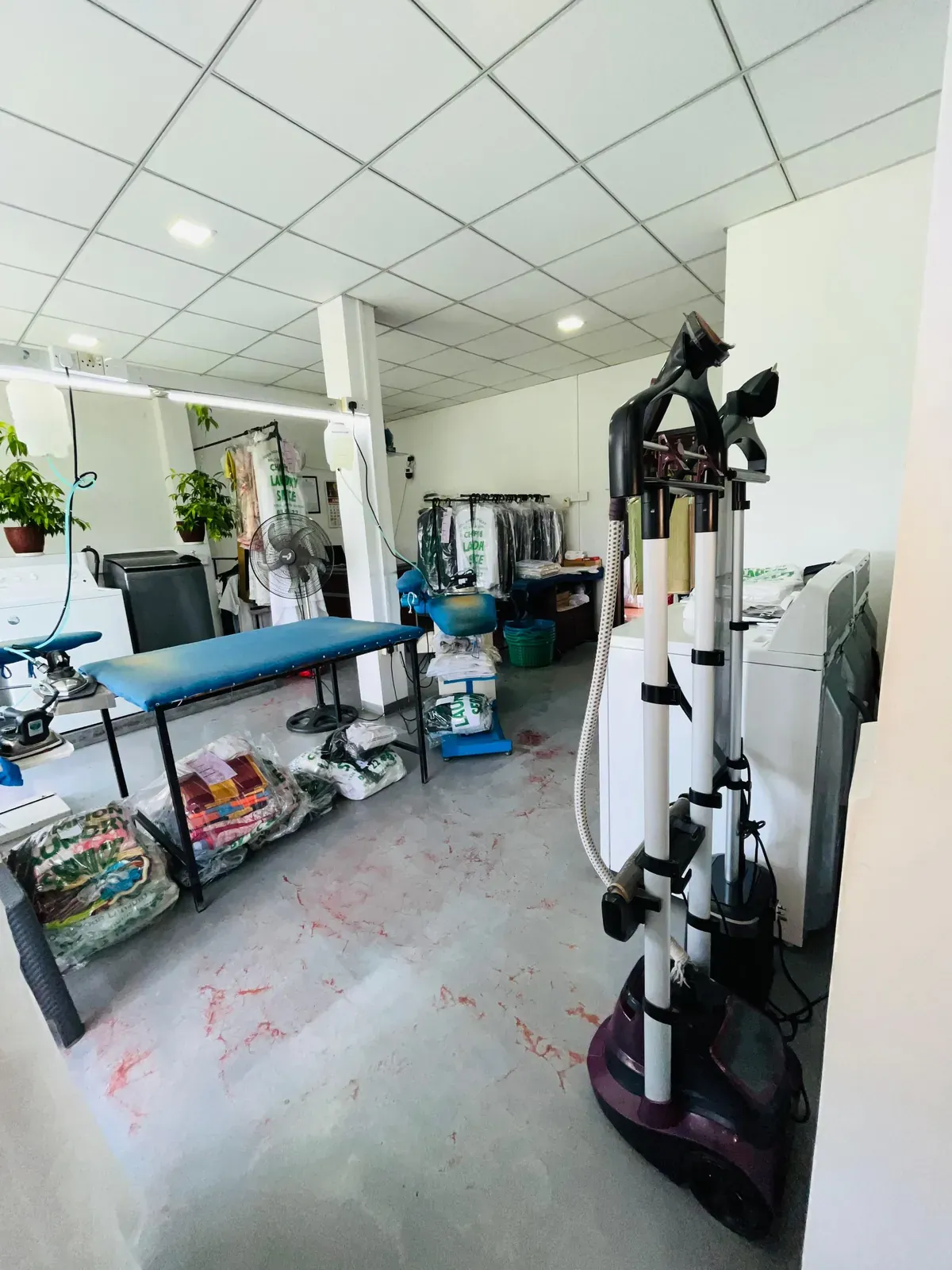 Steam press and garment finishing equipment at Champion Laundry Service, Gampaha