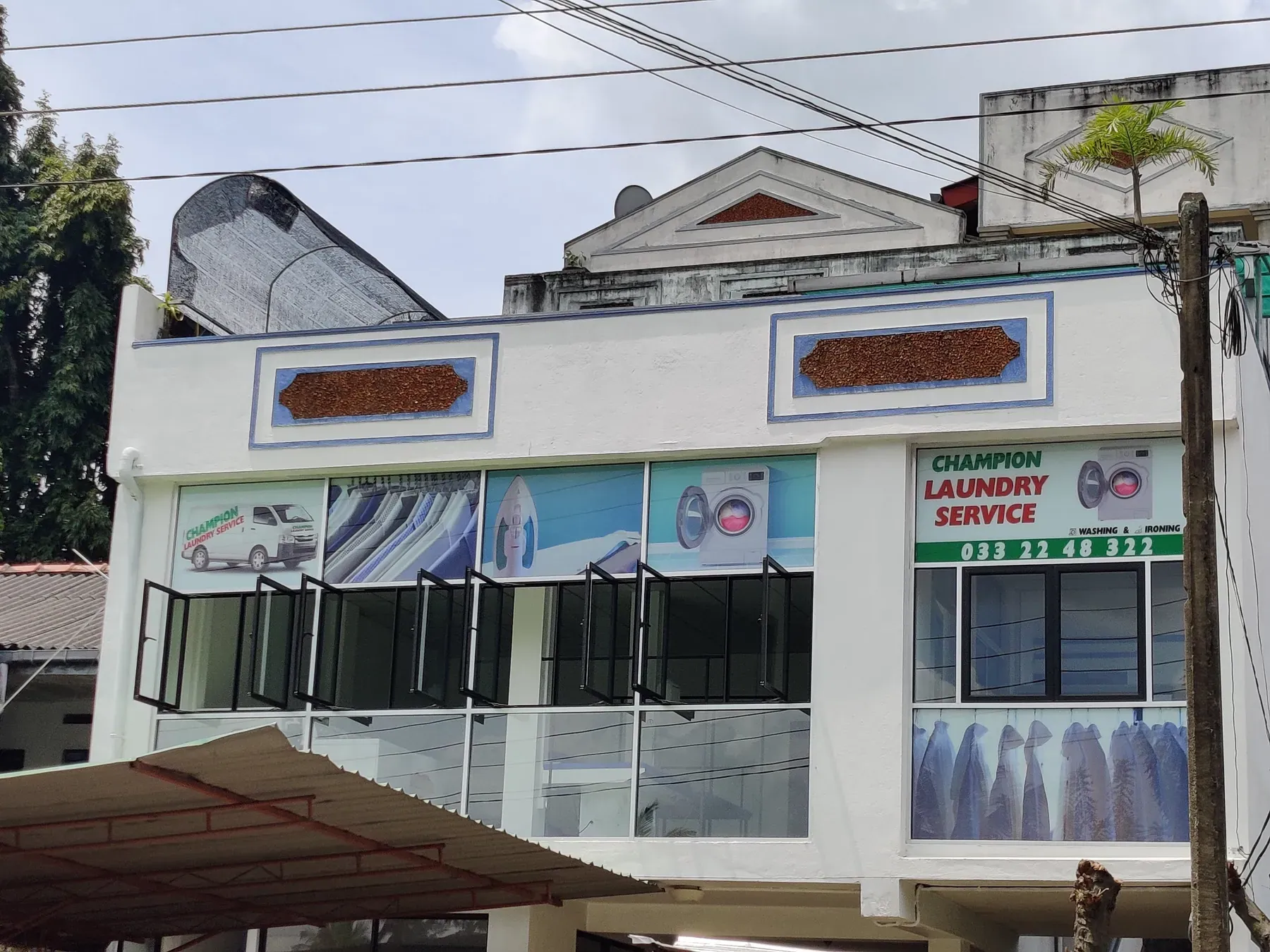 The daytime shopfront of Champion Laundry Service at Kidagammulla, Gampaha